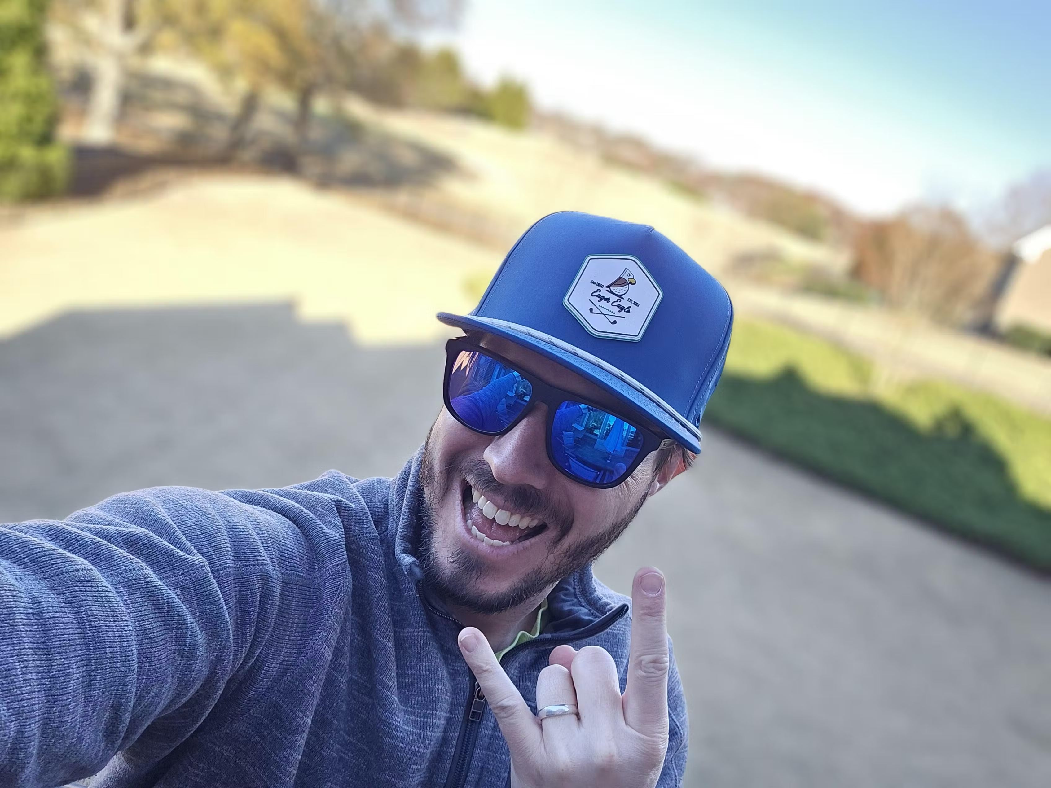 Golfer wearing an Eager Eagle Golf hat
