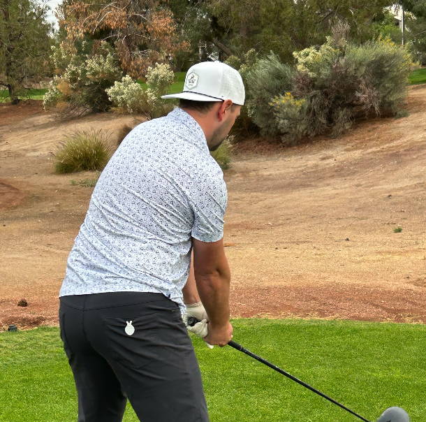Golfer wearing an Eager Eagle Golf hat