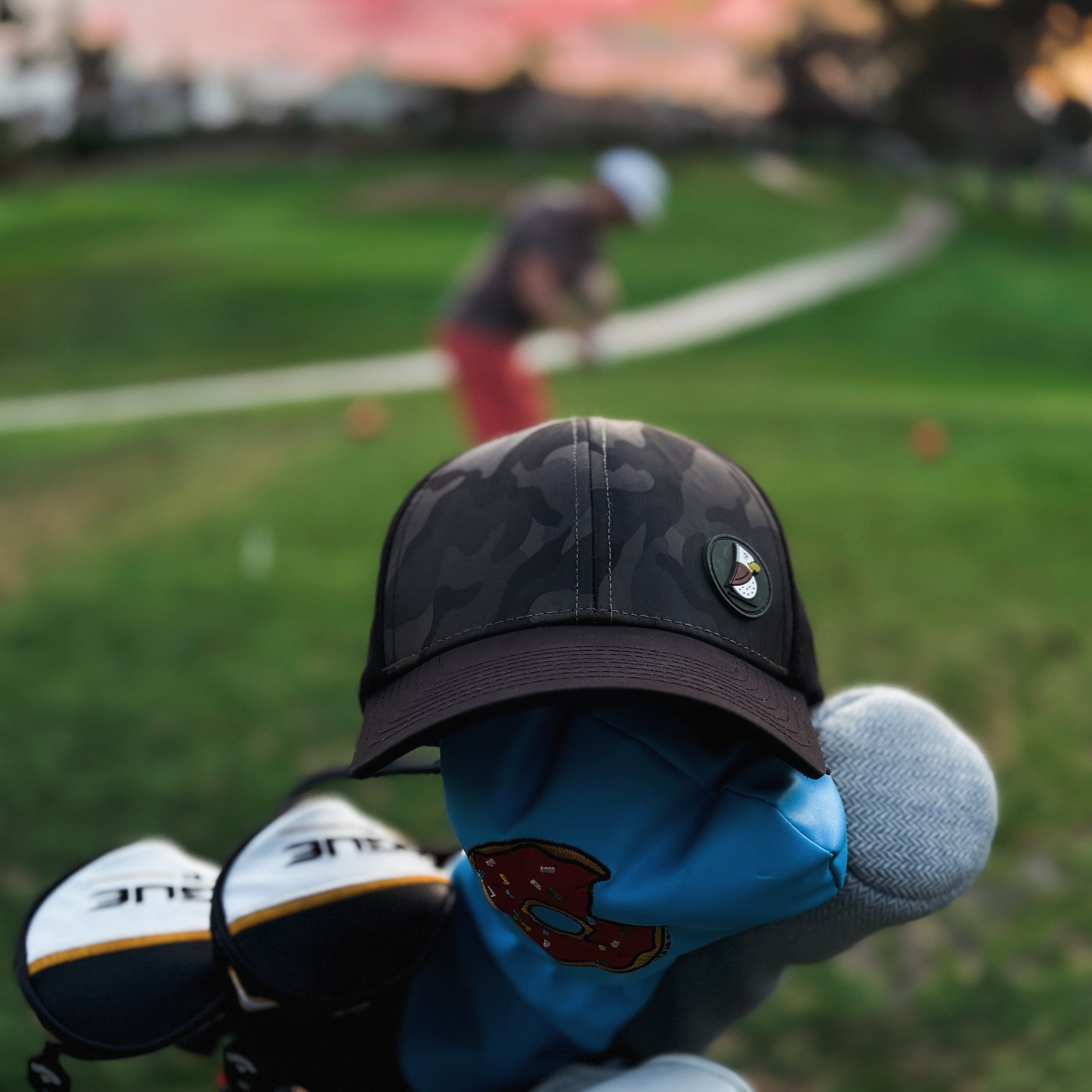 Eager Eagle golf hat with a golf course backdrop
