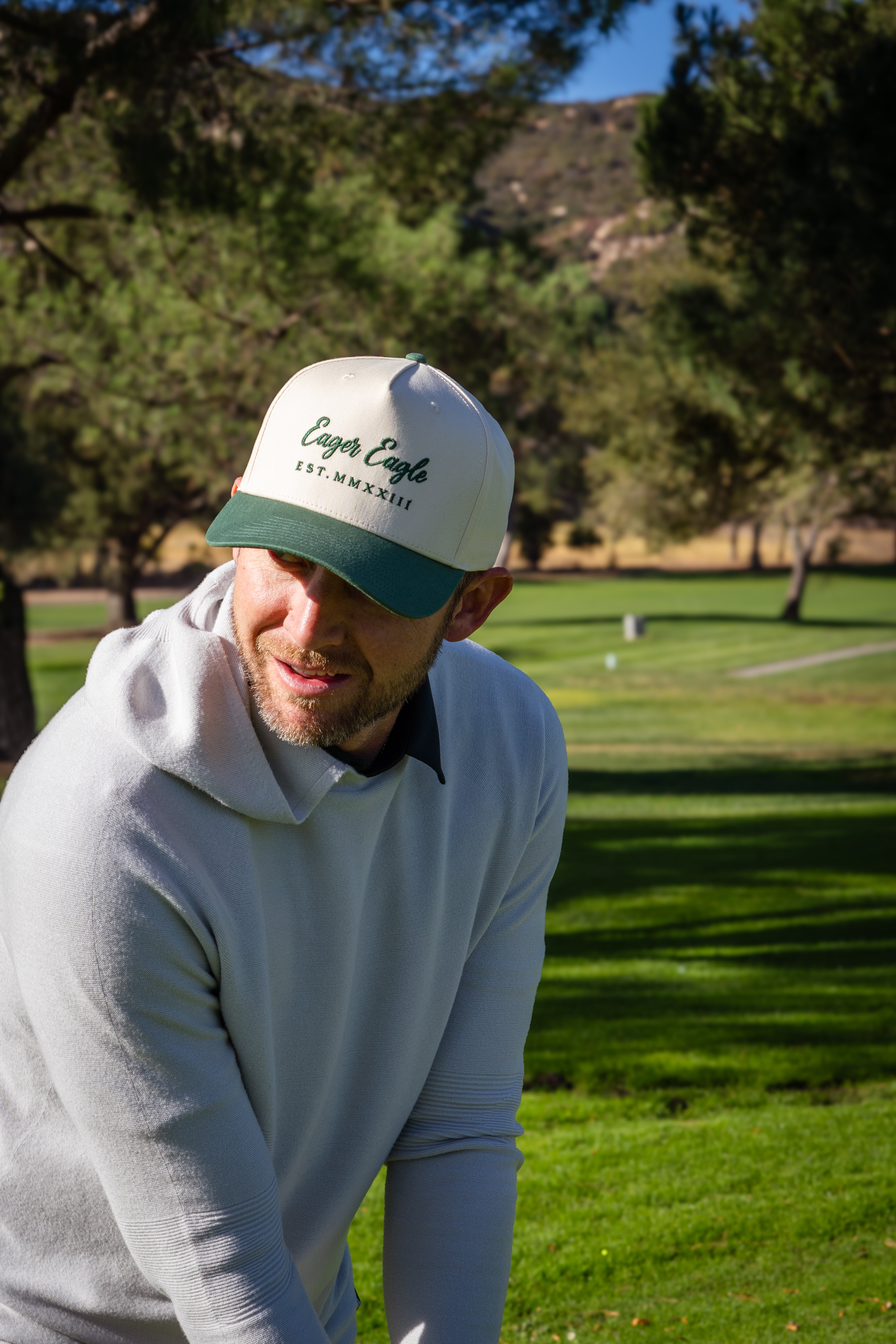 Golfer wearing an Eager Eagle Golf hat