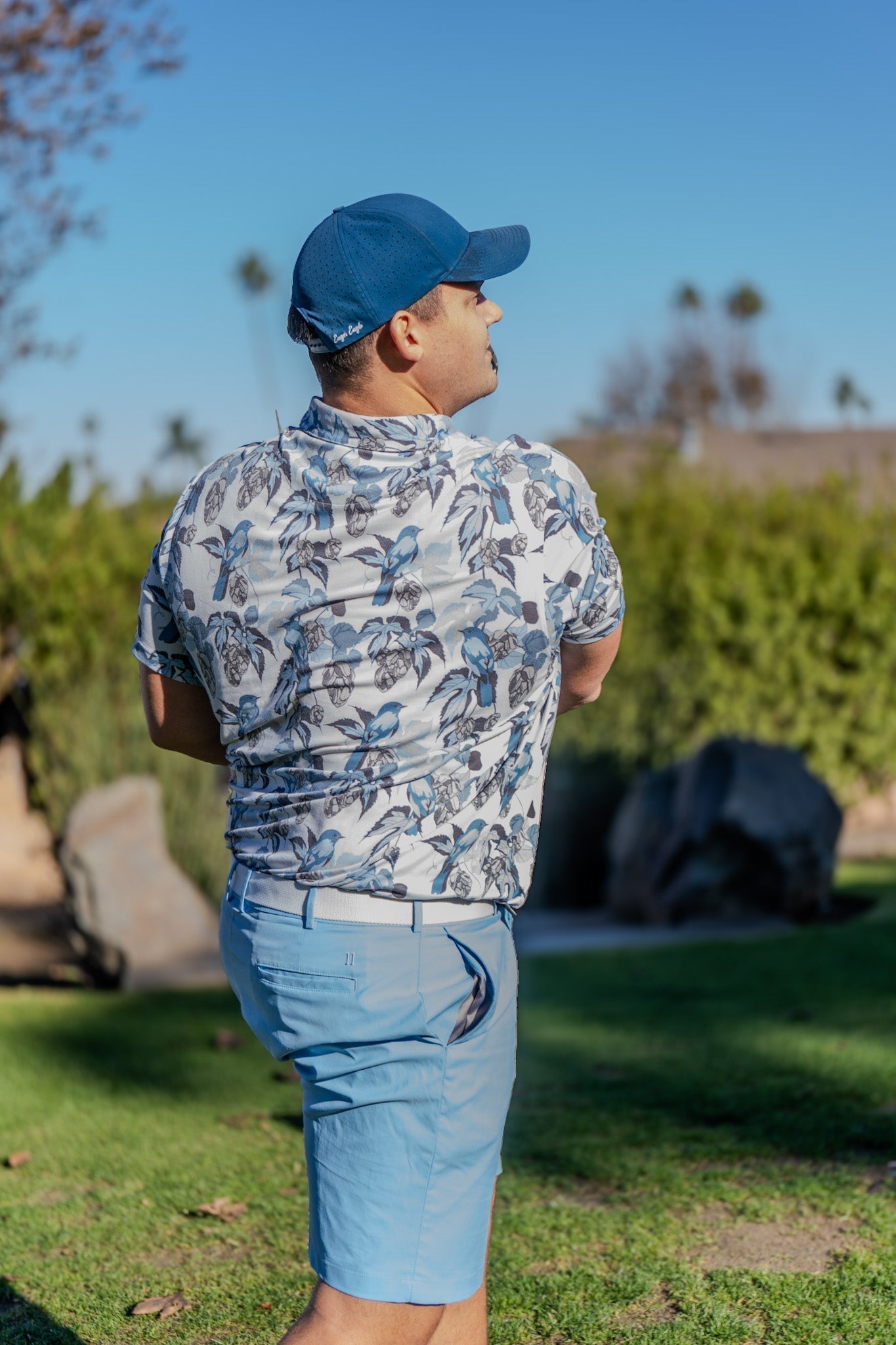 golfer wearing lightweight performance golf hat in sunny weather