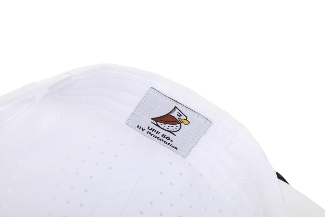 Close-up of the CL | Rope Golf Hat's interior, showing a cartoon bird label, UPF 50+ sun protection text, and small perforations in the moisture-wicking fabric for breathability.
